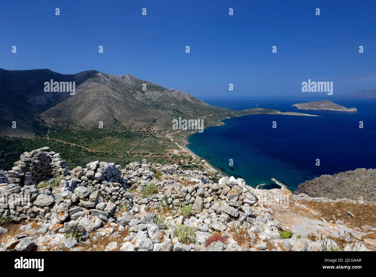 View of Aghios Antonios Bay from the Ancient settlement on hill above Megalo Chorio,  Tilos, Dodecanese islands, Southern Aegean, Greece. Stock Photo