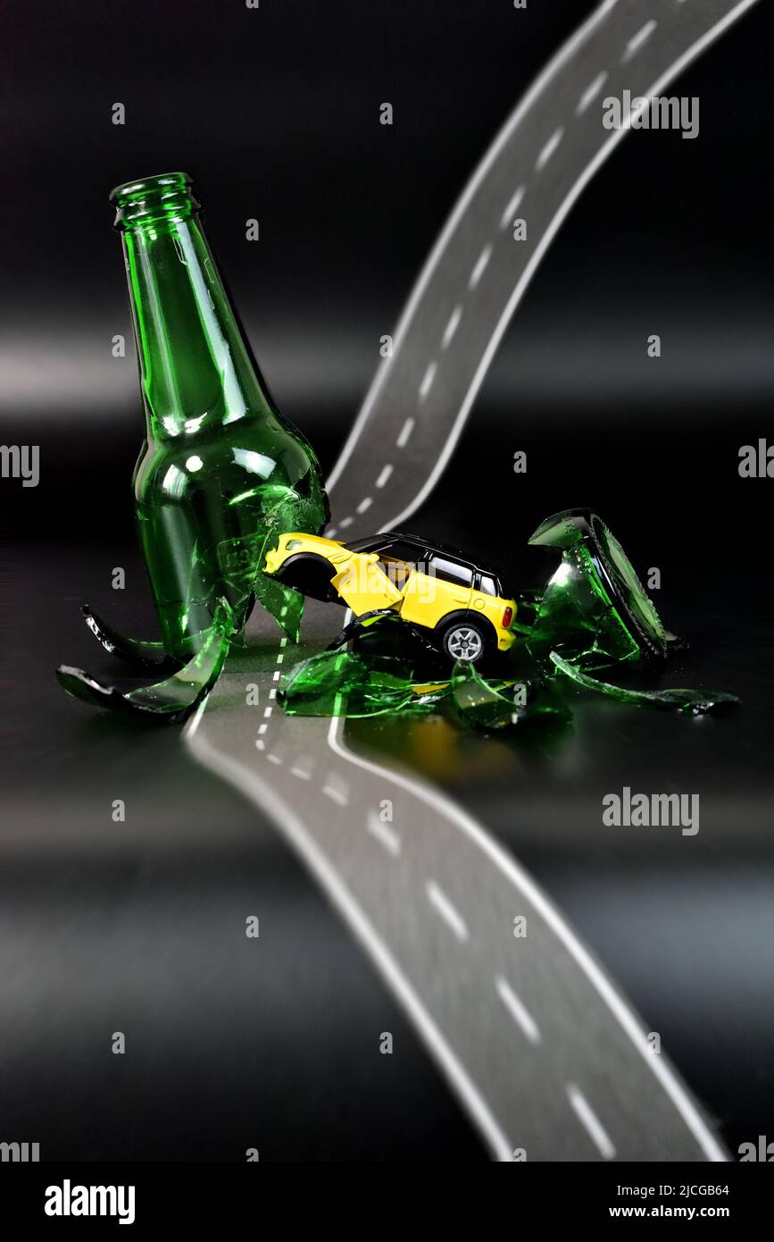 toy car accident with broken glass bottle Stock Photo