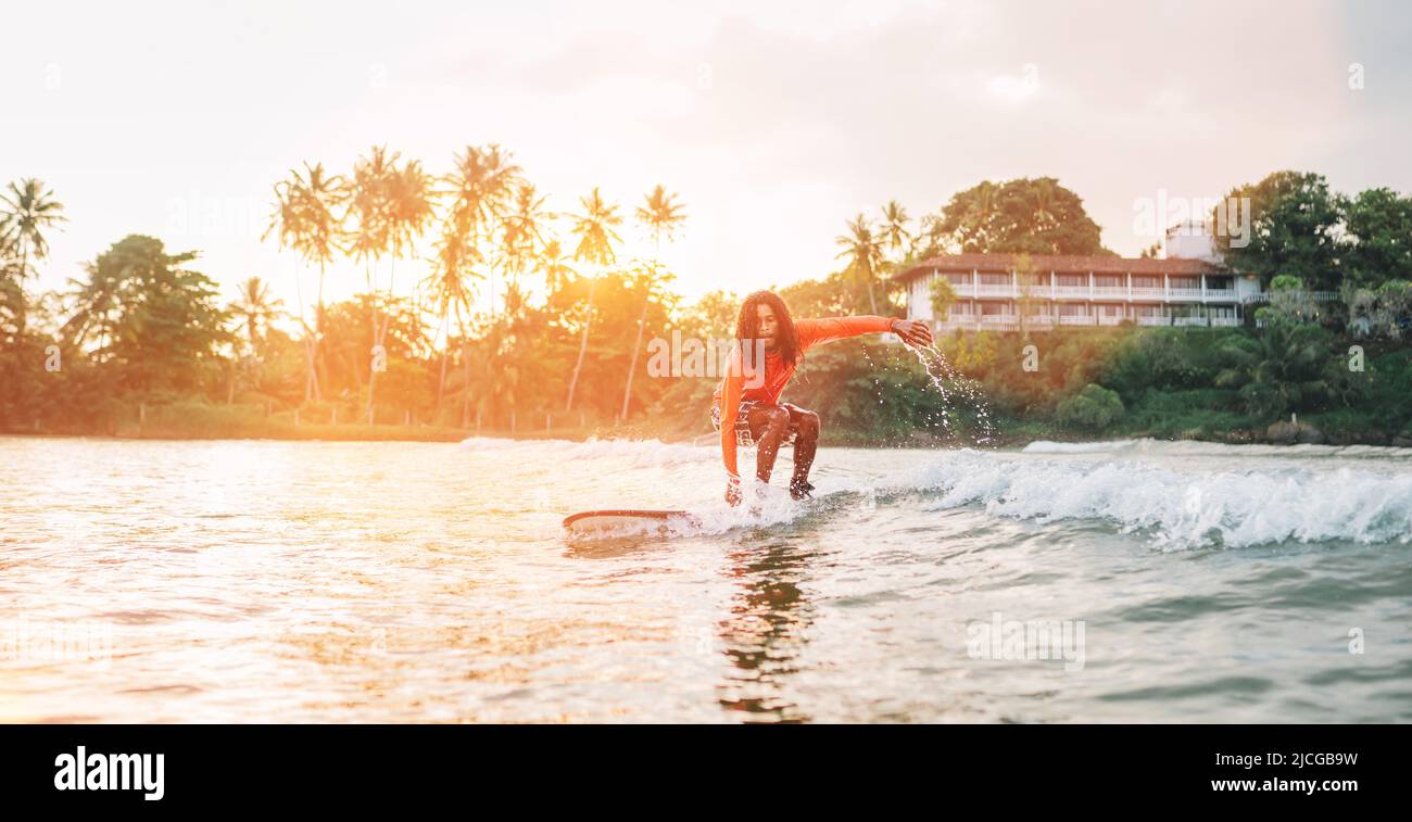 Blue-haired petite teen riding a surfboard - wide 5