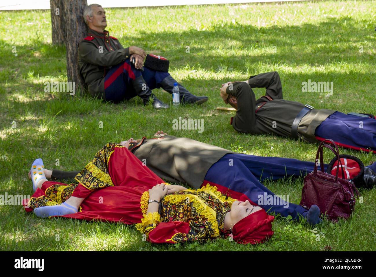 Omsk, Russia. June 12, 2022. Russia Day. Russian Cossacks rest in the shade. Stock Photo