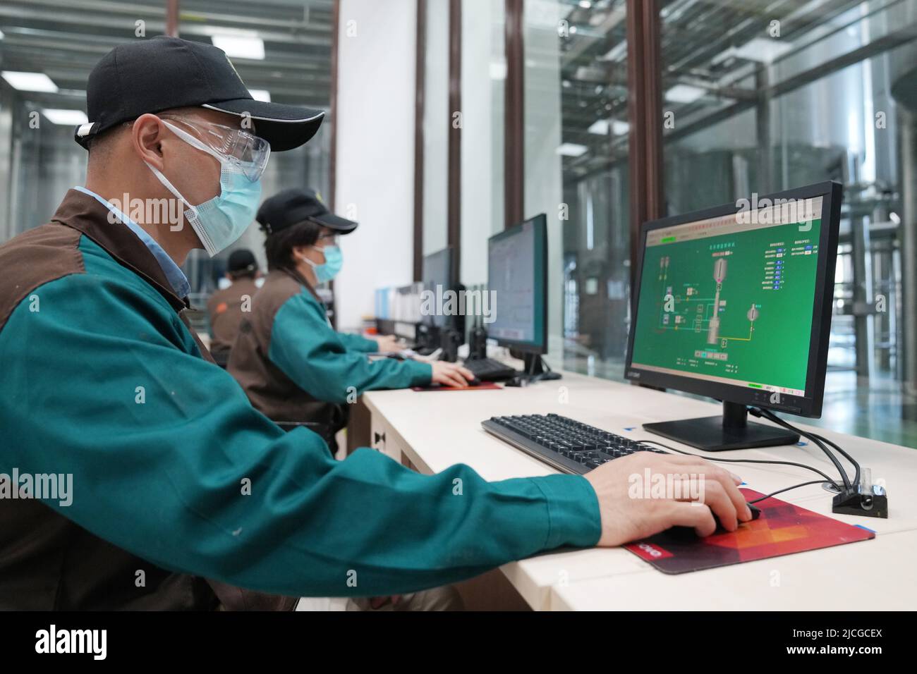 Harbin. 8th June, 2022. Staff members work at a beer company at Suifenhe Area of China (Heilongjiang) Pilot Free Trade Zone, June 8, 2022. Credit: Wang Jianwei/Xinhua/Alamy Live News Stock Photo