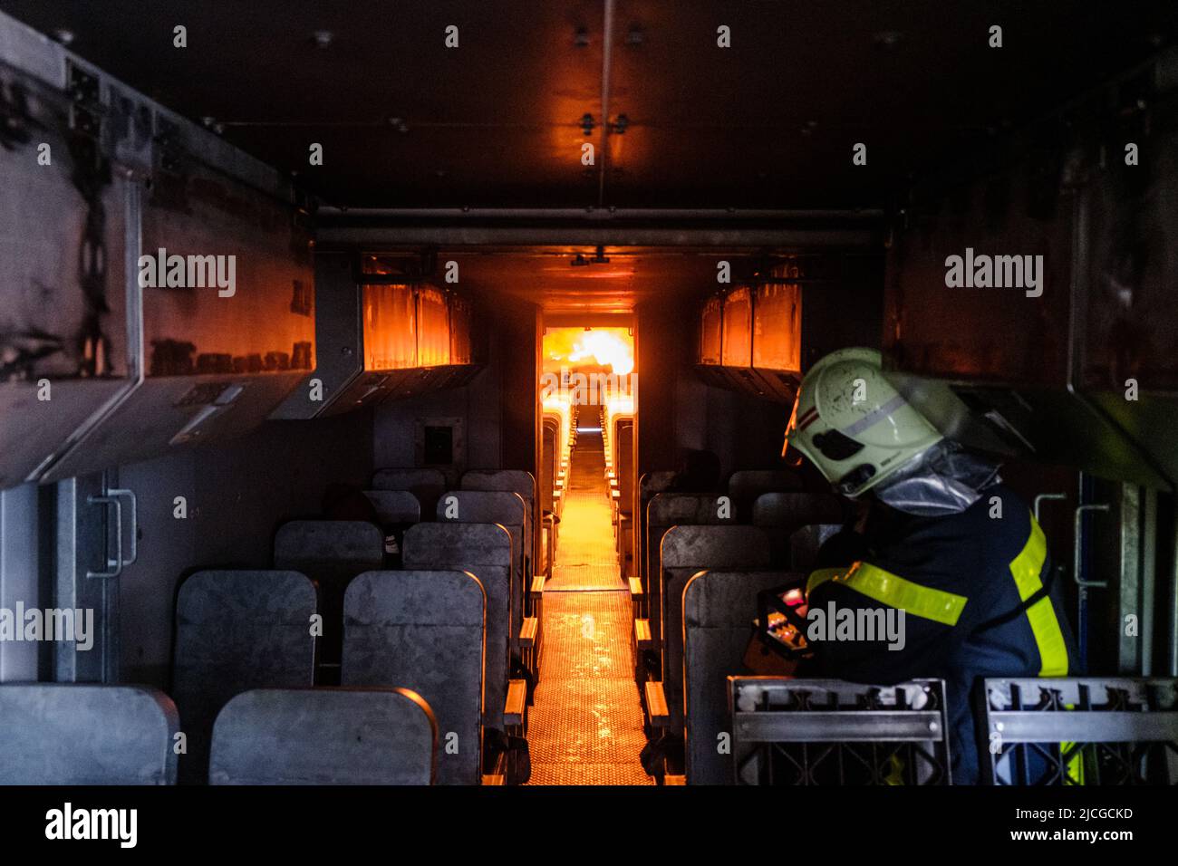 Langenhagen, Germany. 13th June, 2022. Flames blaze during an exercise in the passenger compartment of the airport fire department's mobile fire simulation facility at Hannover Airport. The facility is a joint project of Hannover, Stuttgart and Bremen airports and is intended to serve the training and exercise of airport firefighters. Credit: Ole Spata/dpa/Alamy Live News Stock Photo
