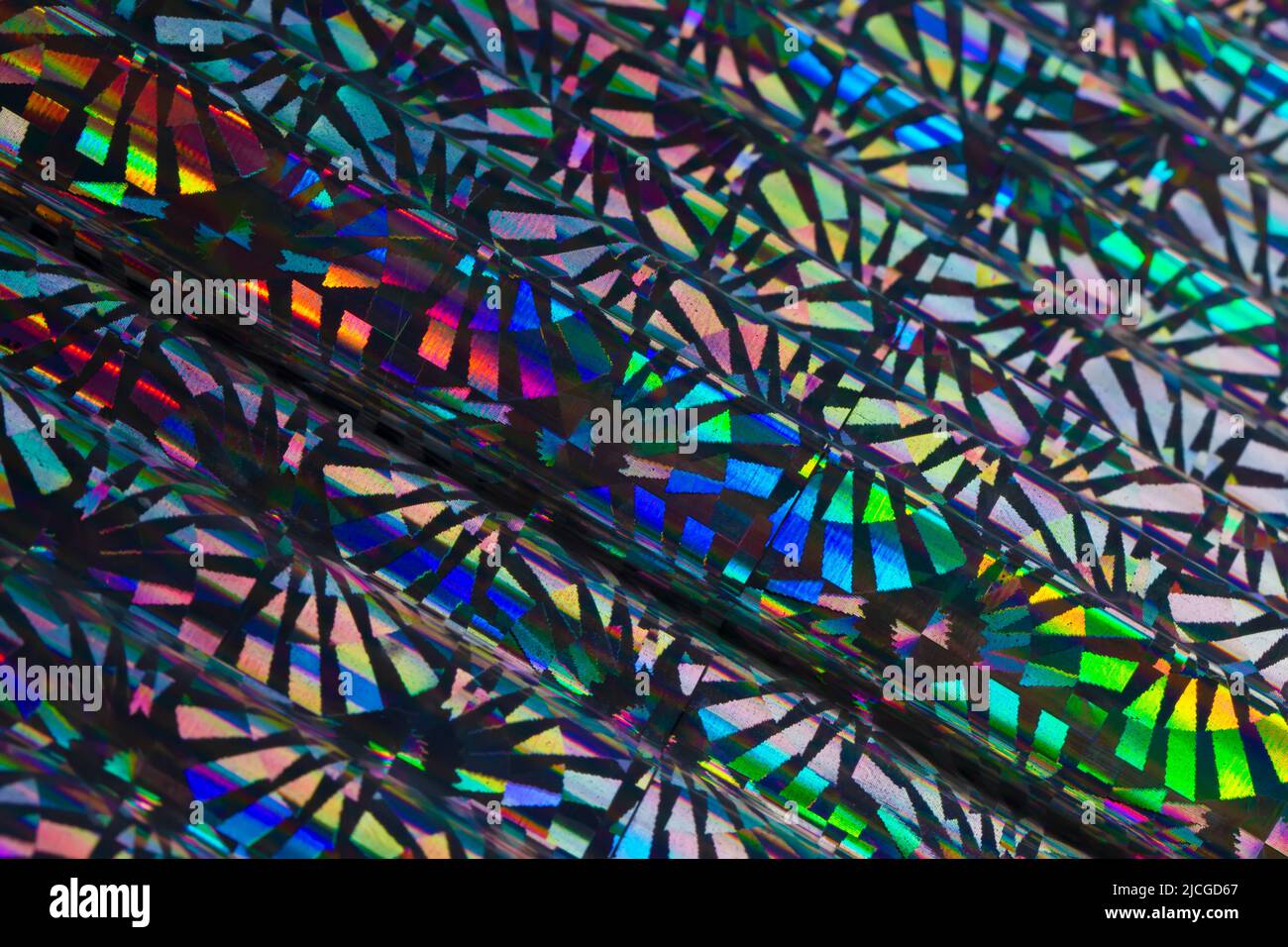 Iridescent holographic metal foil background. Stock Photo