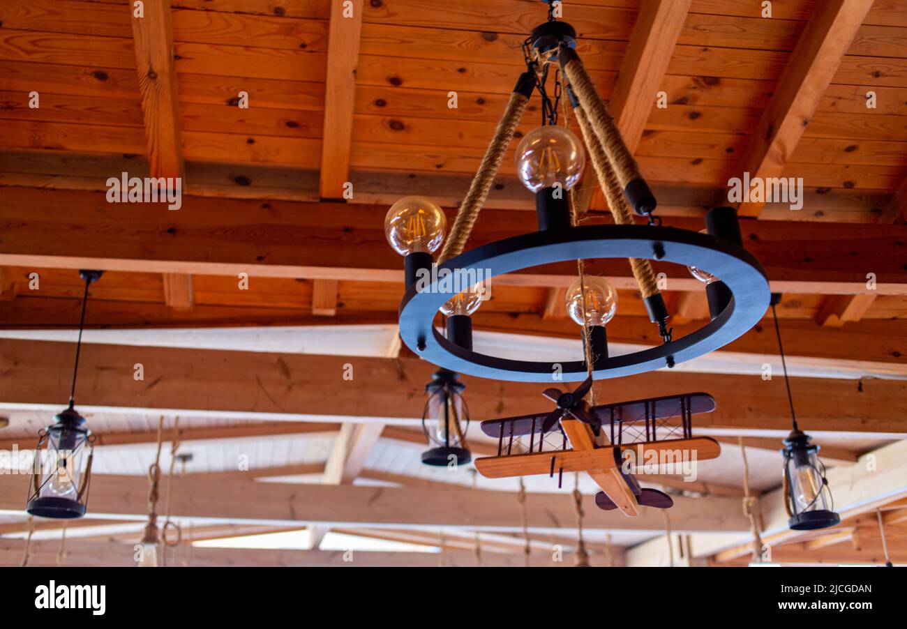 Beautiful hanging lamps and a wooden plane Stock Photo Alamy