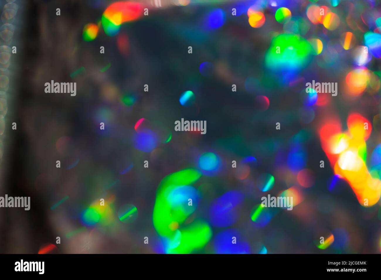 Rainbow holographic bokeh background. Multicolored overflows of color. Stock Photo