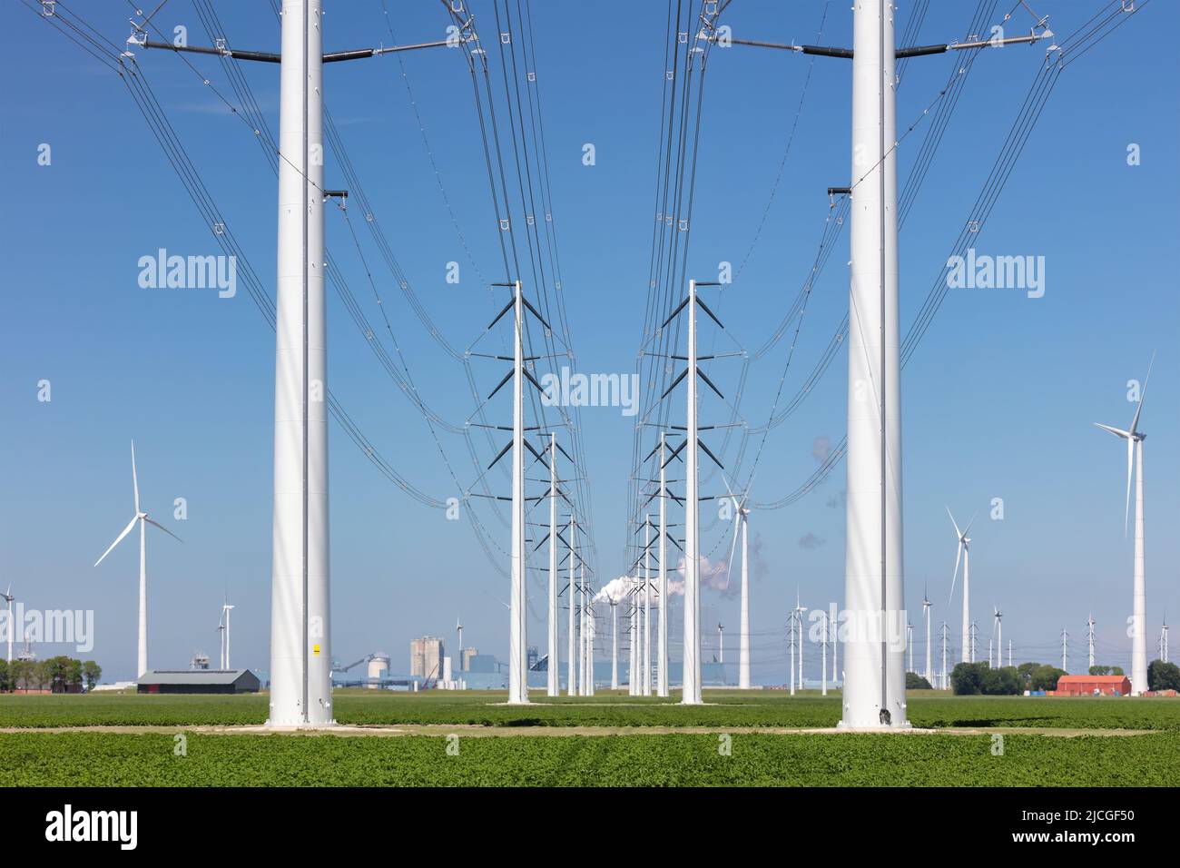 Electricity transmission towers in front of a Dutch power station in