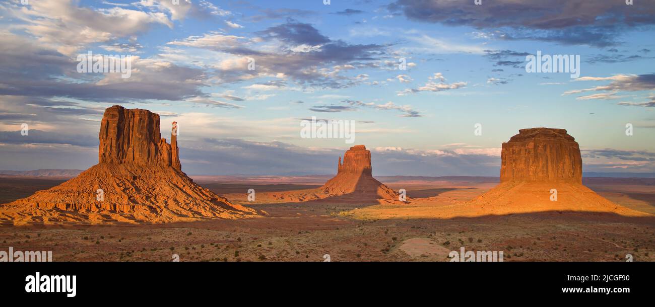 Panorama of the Mittens and Merrick Butte at dusk, Monument Valley, Arizona, United States. Stock Photo