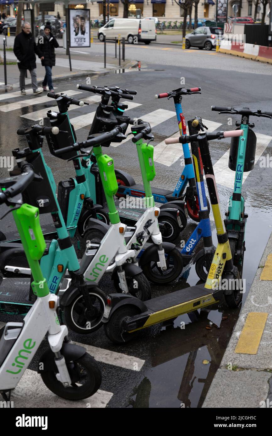 Rental e-scooters parked on a street in Paris, France Stock Photo