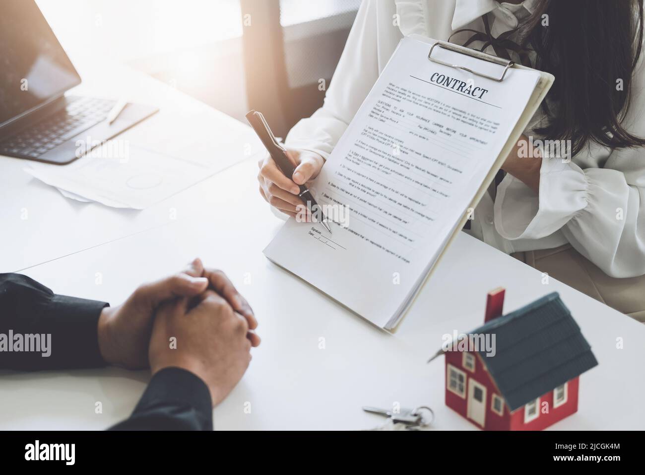 Guarantee, Mortgage, agreement, contract, Signing, Male client holding pen to reading agreement