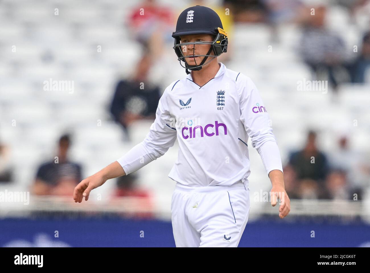 Ollie Pope of England tight on the wicket with his helmet on Stock