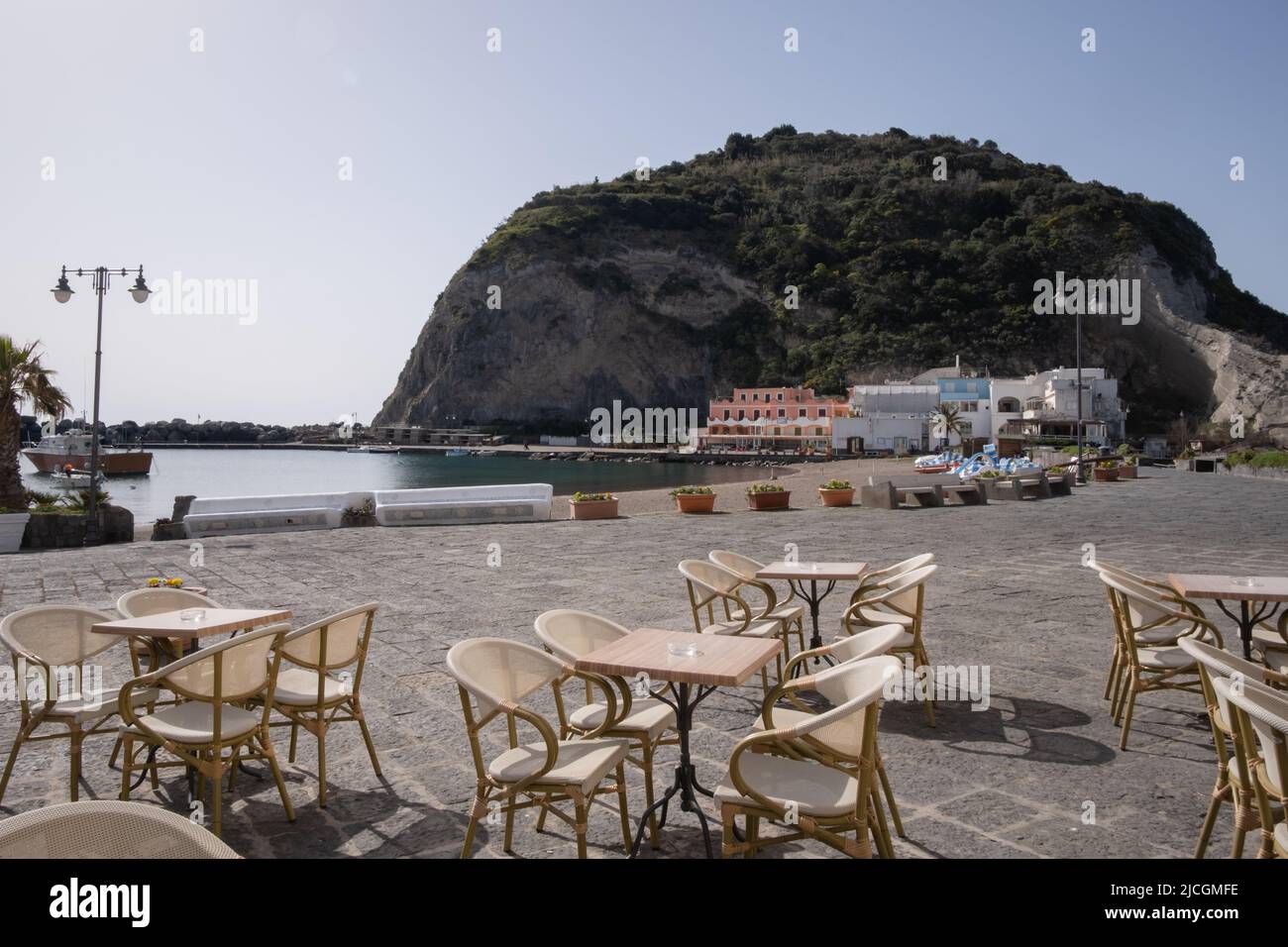 Street cafe in front of San Angelo rock on ischia island Stock Photo