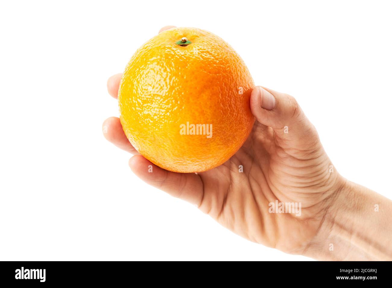 Hand of a woman holding a succulent orange. Healthy food Stock Photo