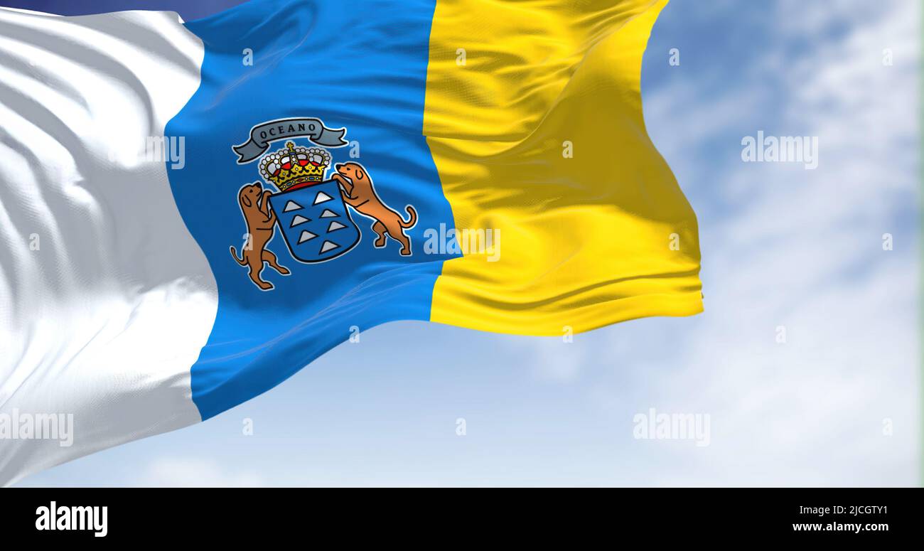 The Canary Islands flag waving in the wind on a clear day. The Canary Islands are a Spanish region and archipelago in the Atlantic Ocean, in Macarones Stock Photo