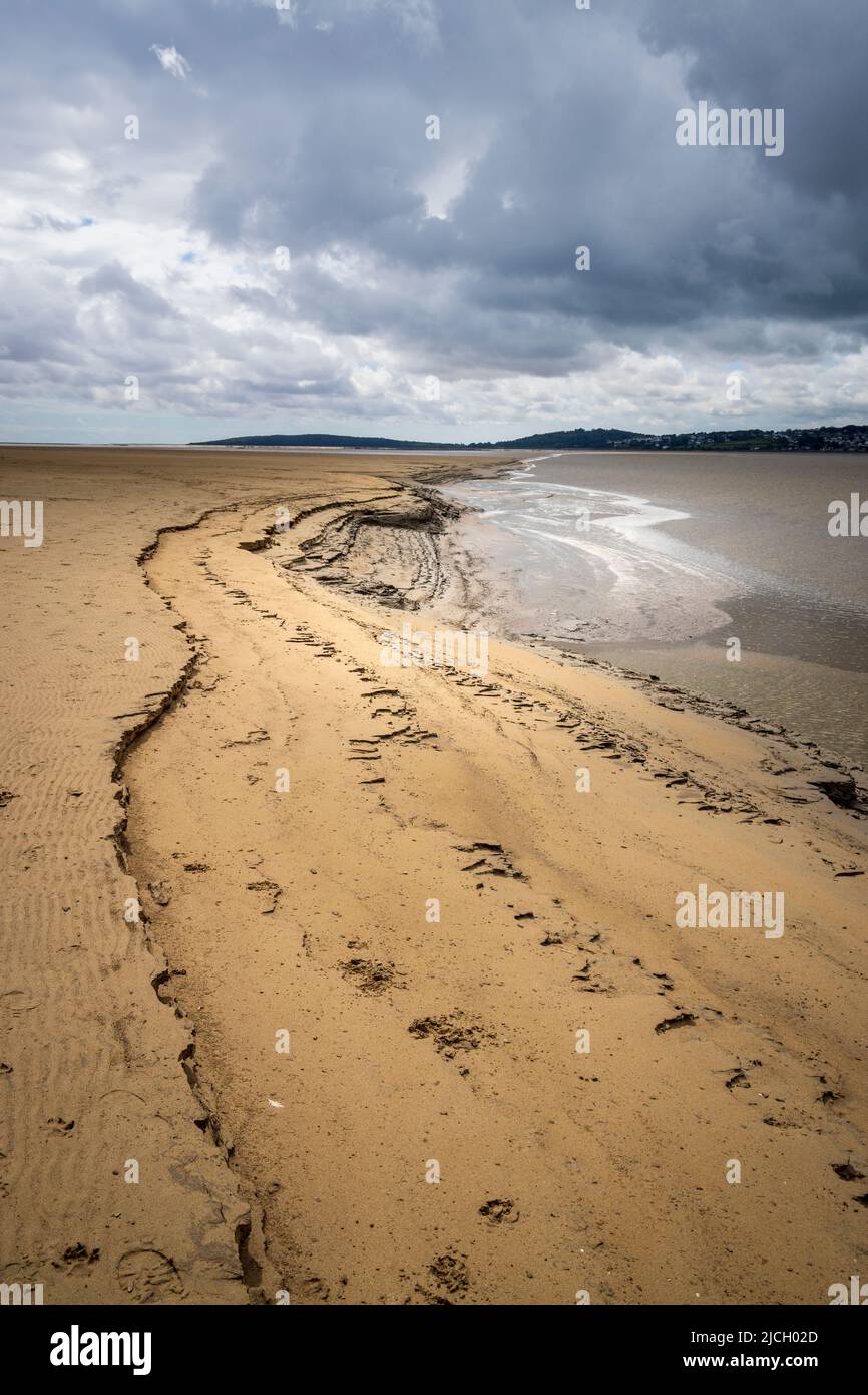 Layers of sand and mud at low-tide along the Kent Channel flowing into Morecombe Bay near Arnside, Lancashire, England Stock Photo