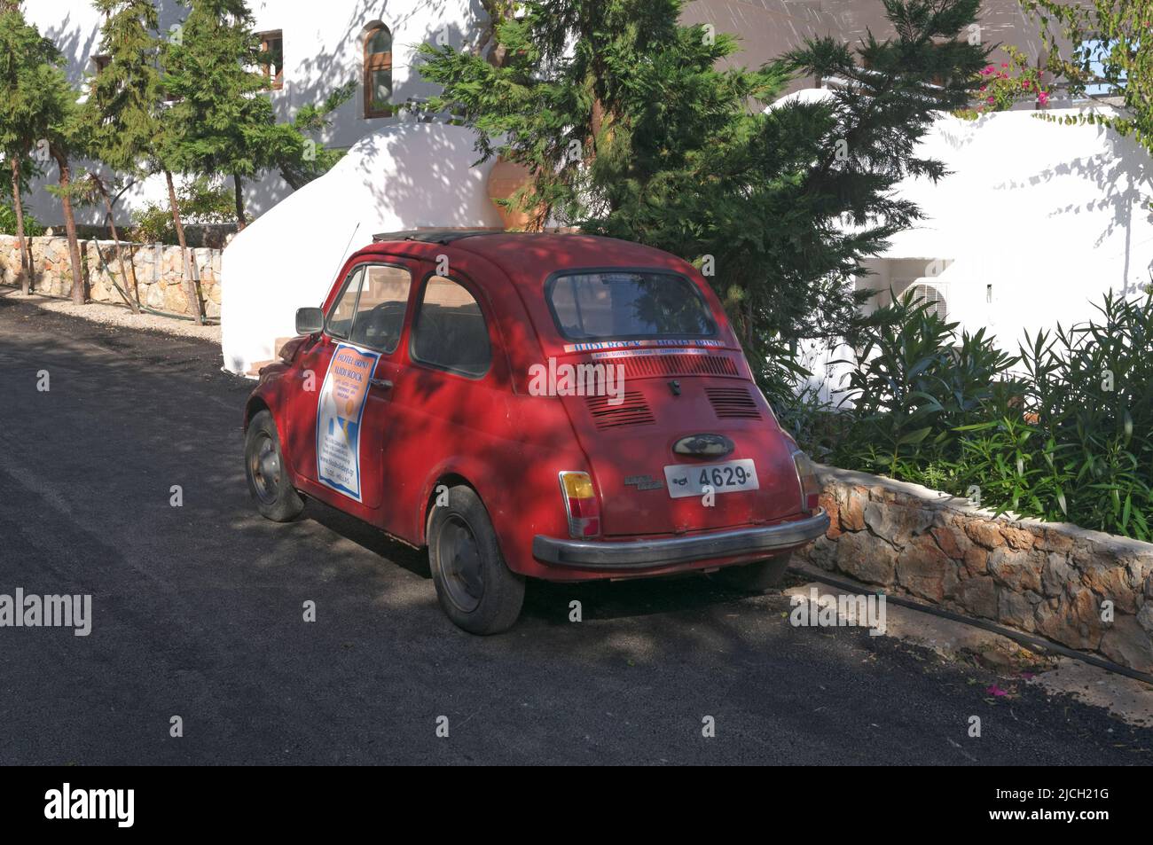 vintage small car on Tilos island. Used as an advertisement for a local hotel. May 2022. Spring. cym Stock Photo