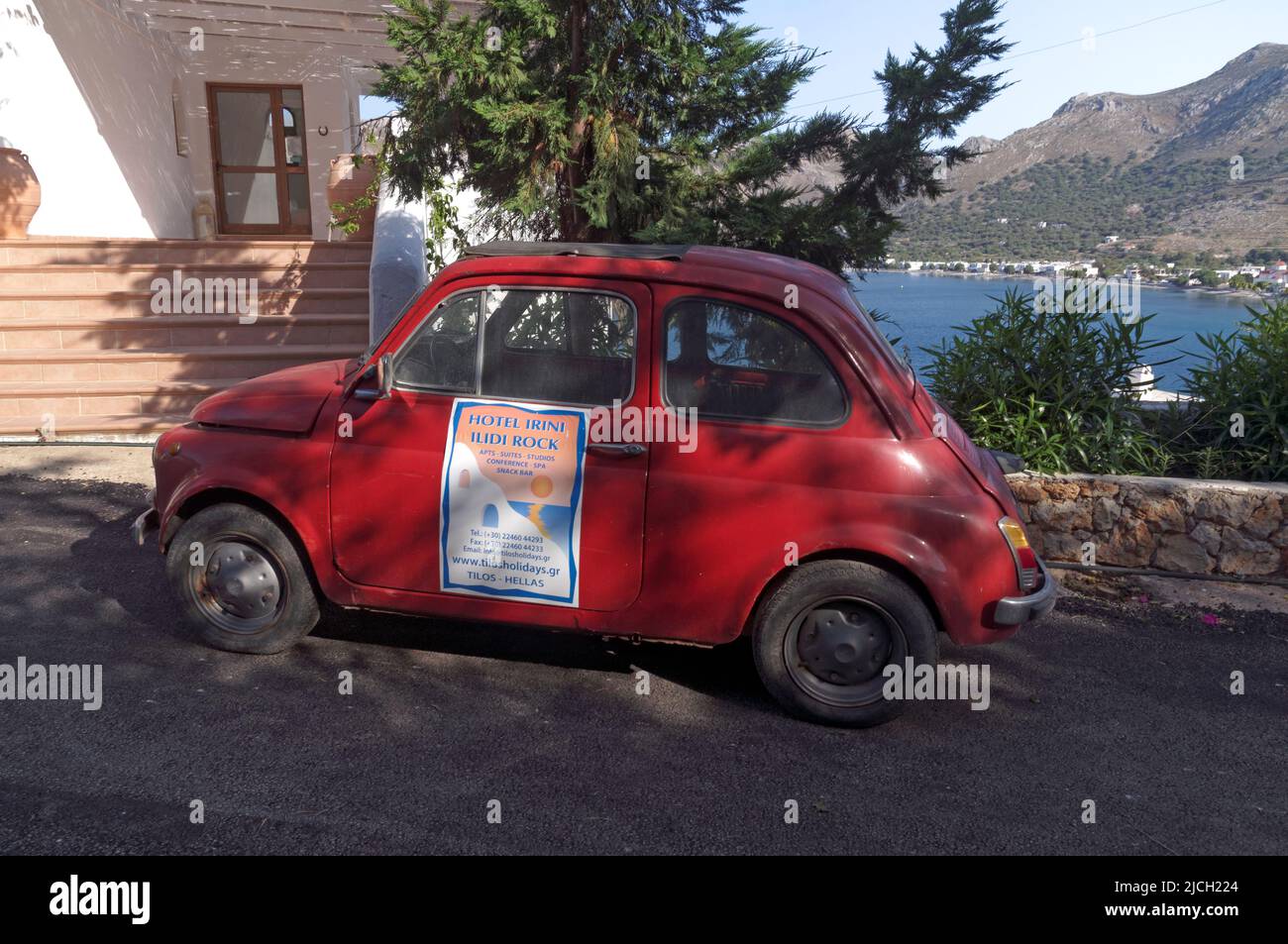 vintage small car on Tilos island. Used as an advertisement for a local hotel. May 2022. Spring. cym Stock Photo
