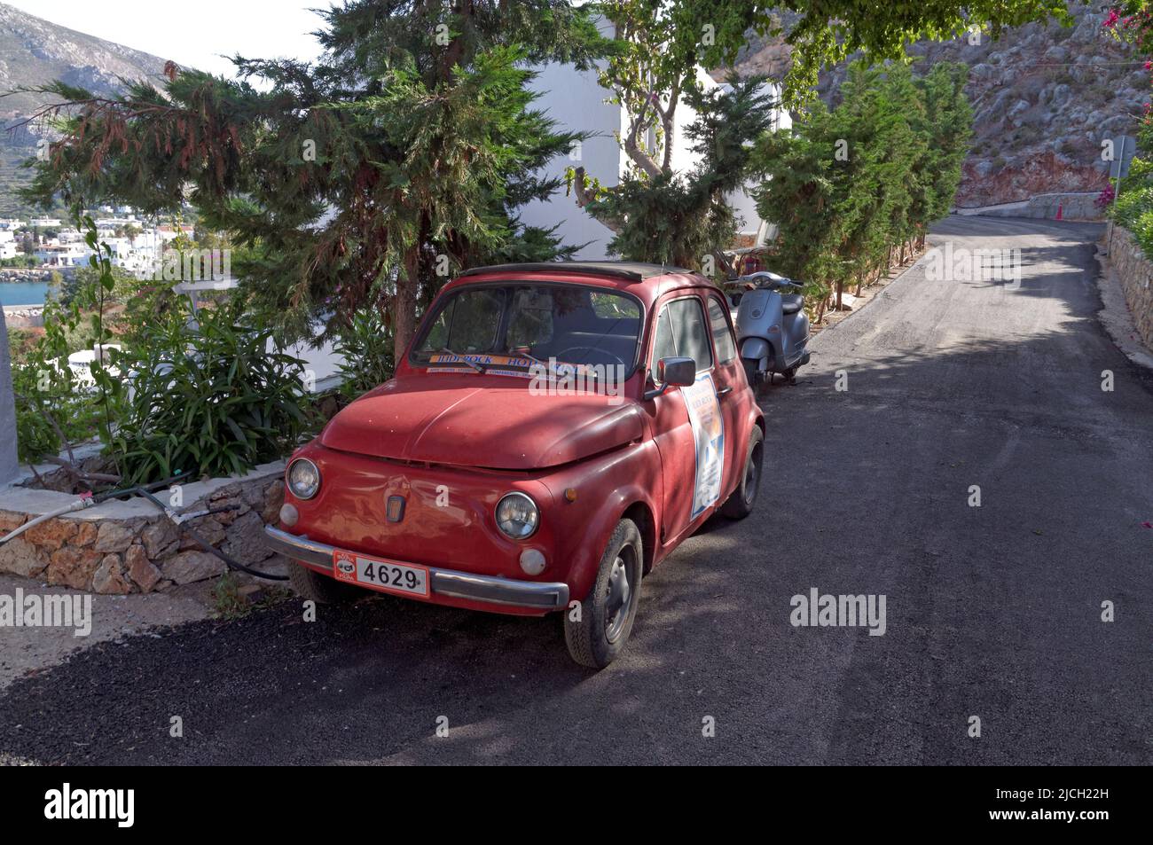 vintage small car on Tilos island. Used as an advertisement for a local hotel. May 2022. Spring. cym Stock Photo