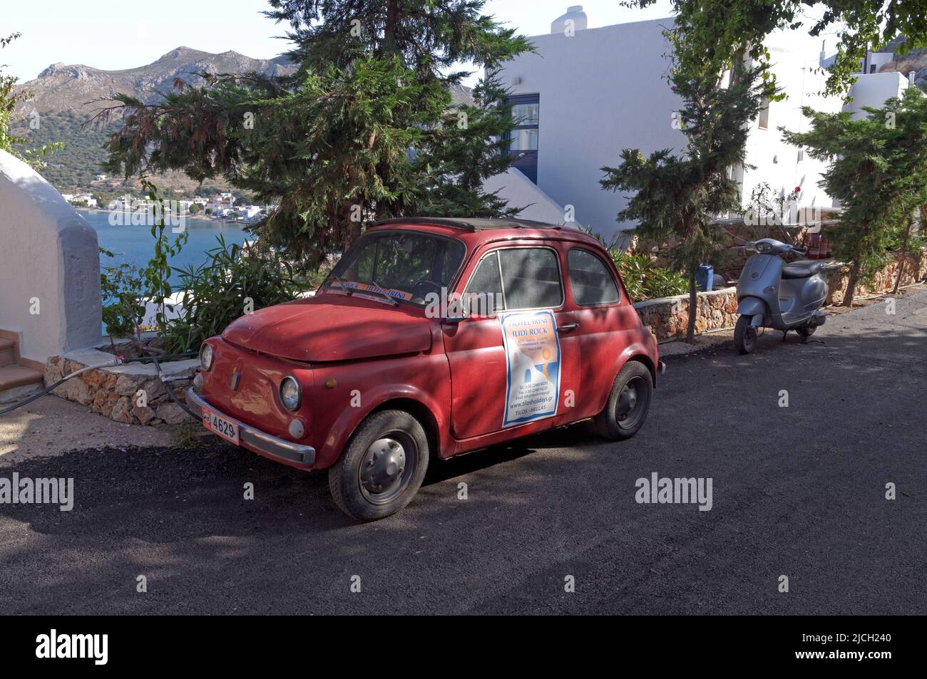 vintage small car on Tilos island. Used as an advertisement for a local hotel. May 2022. Spring. cym Stock Photo