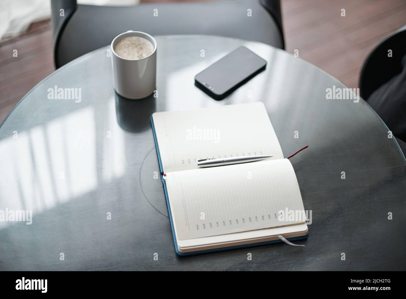 open notebook on the coffee table. close-up. Stock Photo