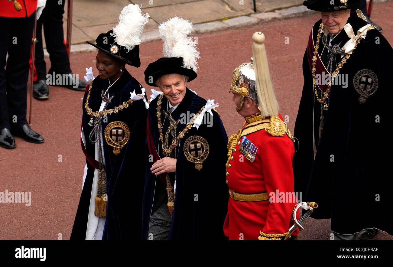 Former Prime Minister Tony Blair (centre) and Baroness Amos walk in the