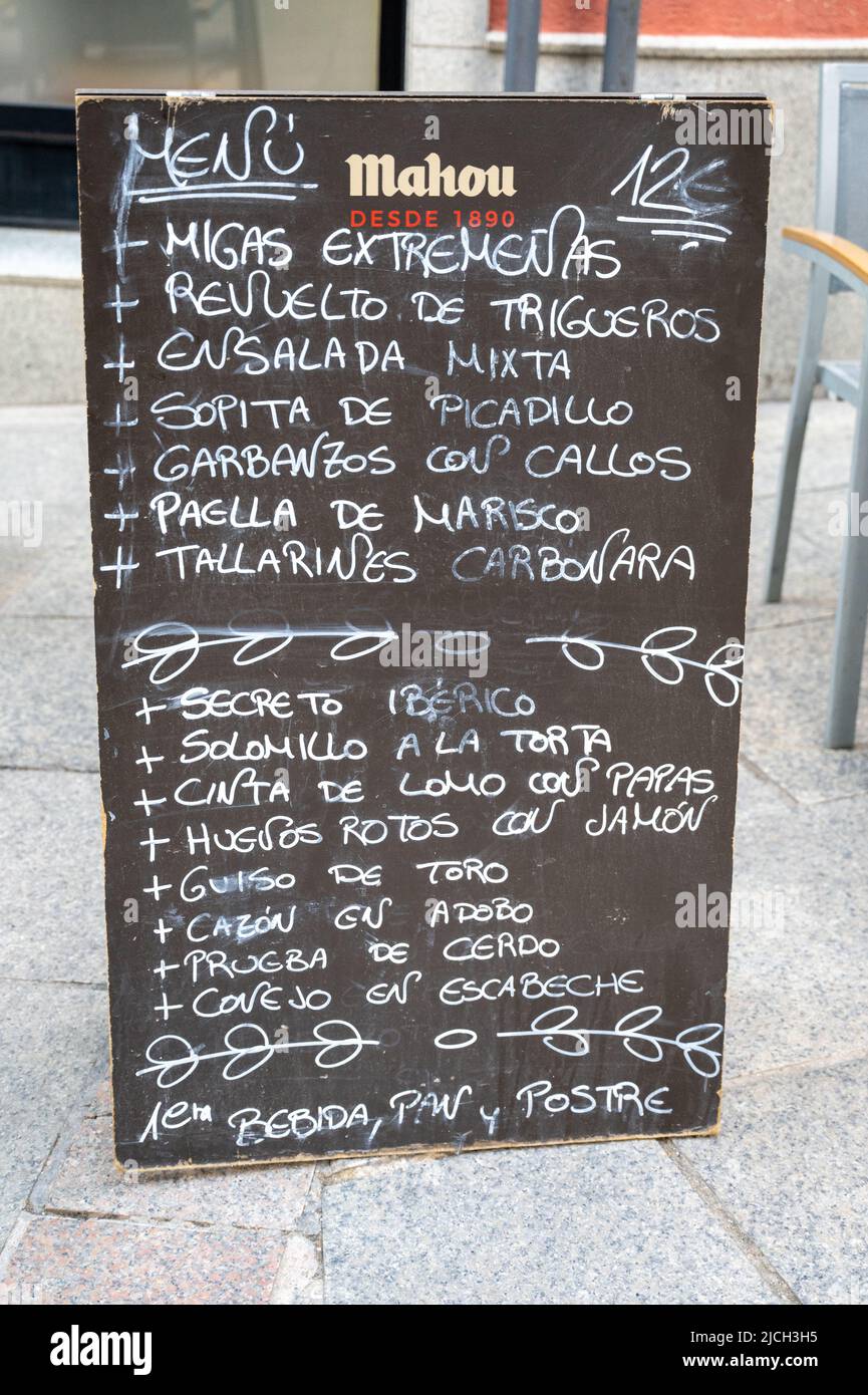 A blackboard menu outside a Spanish restaurant selling Spanish food and drink in Caceres Sopain Stock Photo