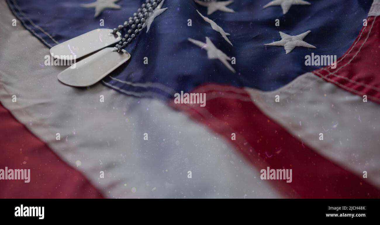 Military dog tags over american flag background with copy space Stock