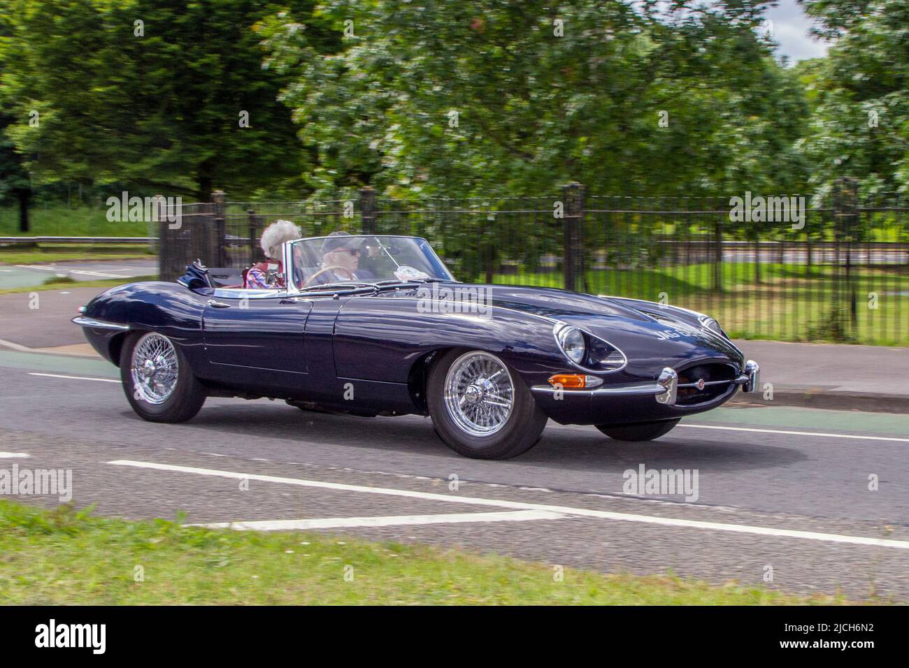 1969 60s sixties blue British Jaguar E Type 4235cc petrol roadster; automobiles featured during the 58th year of the Manchester to Blackpool Touring Assembly for Veteran, Vintage, Classic and Cherished cars. Stock Photo