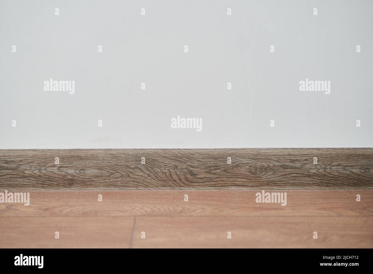 Floor with white wall and skirting board  Stock Photo