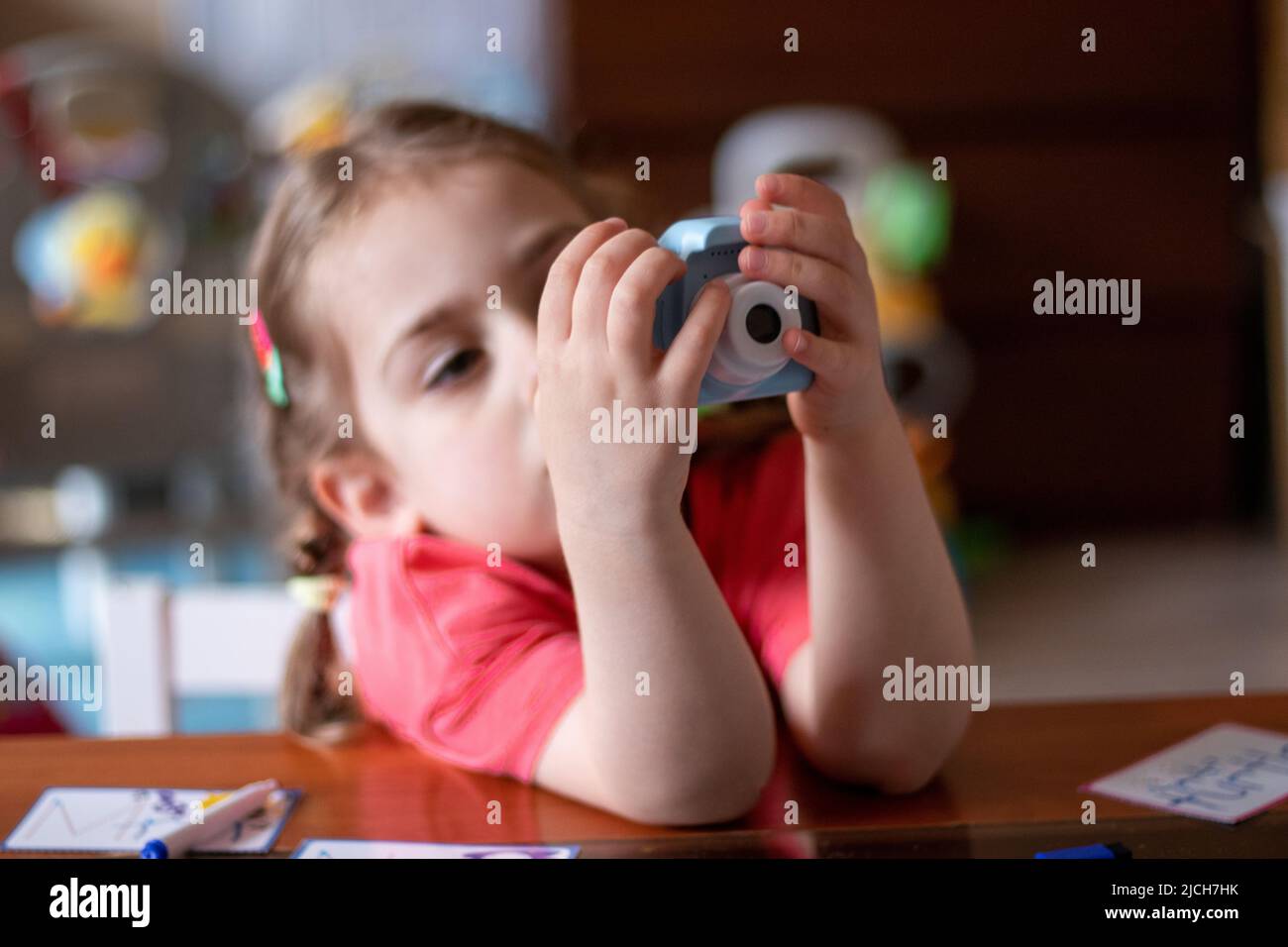 little child playing with a toy Stock Photo - Alamy