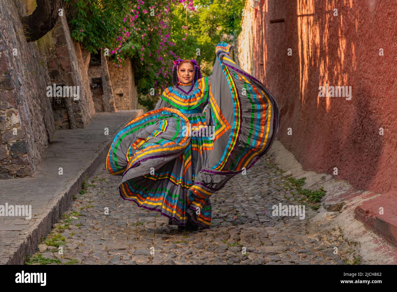 Mexican girl with folk costume for traditional mexican mariachi dance Stock Photo