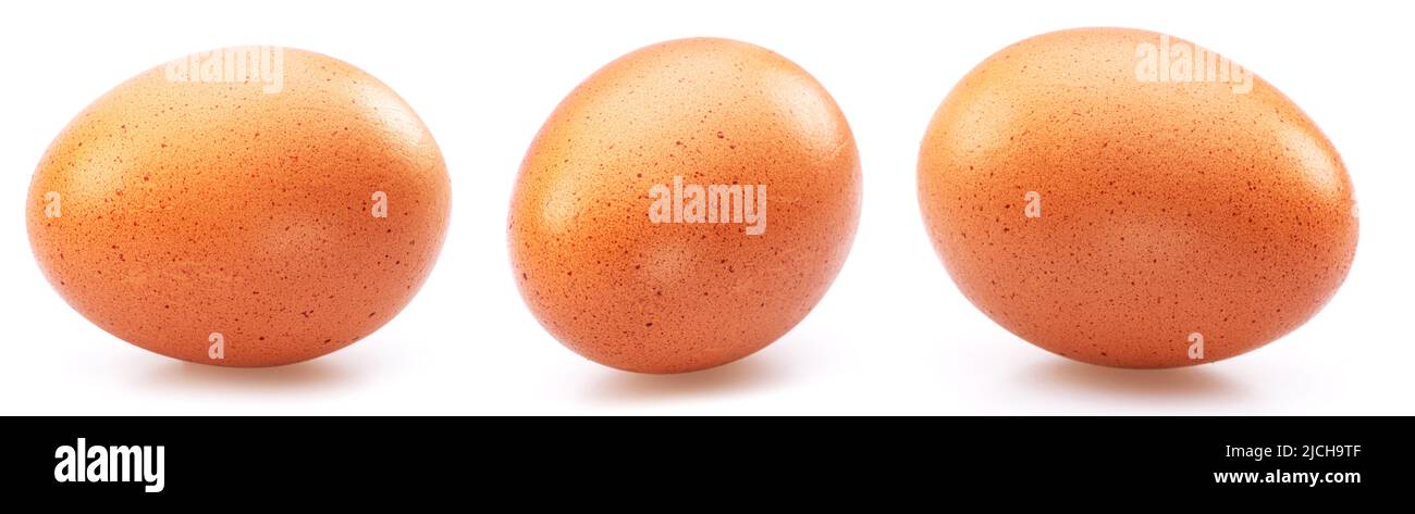 Three brown chicken eggs isolated on white background. Stock Photo