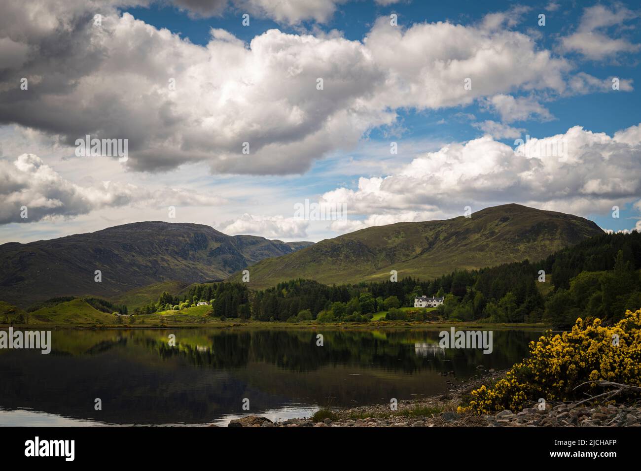 A summer HDR image of Scardroy Lodge on the Strathconon Estate at the head of Loch Beannacharain, Strathconon, Scotland. 02 June 2022 Stock Photo
