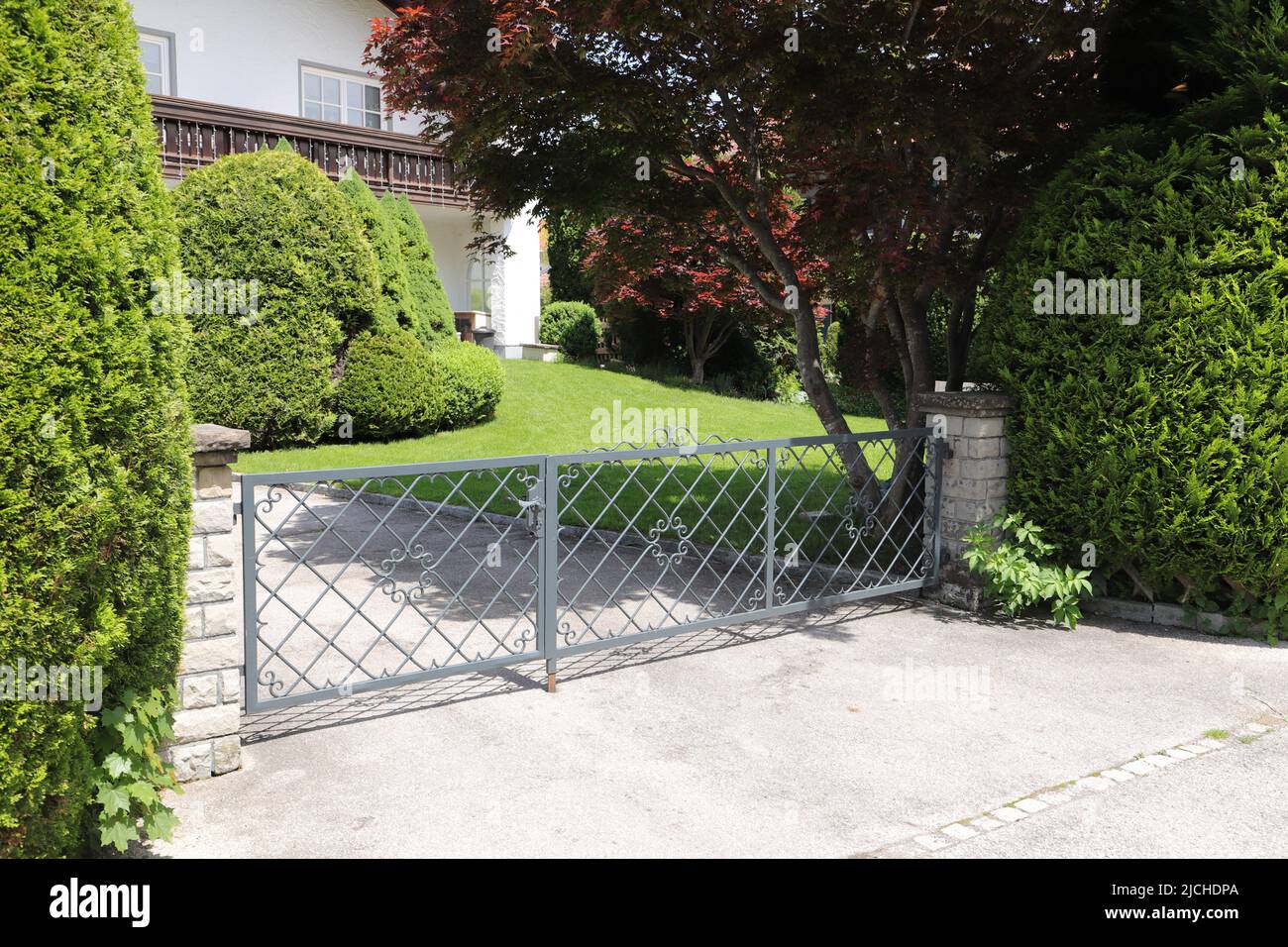 a new house with a driveway gate Stock Photo