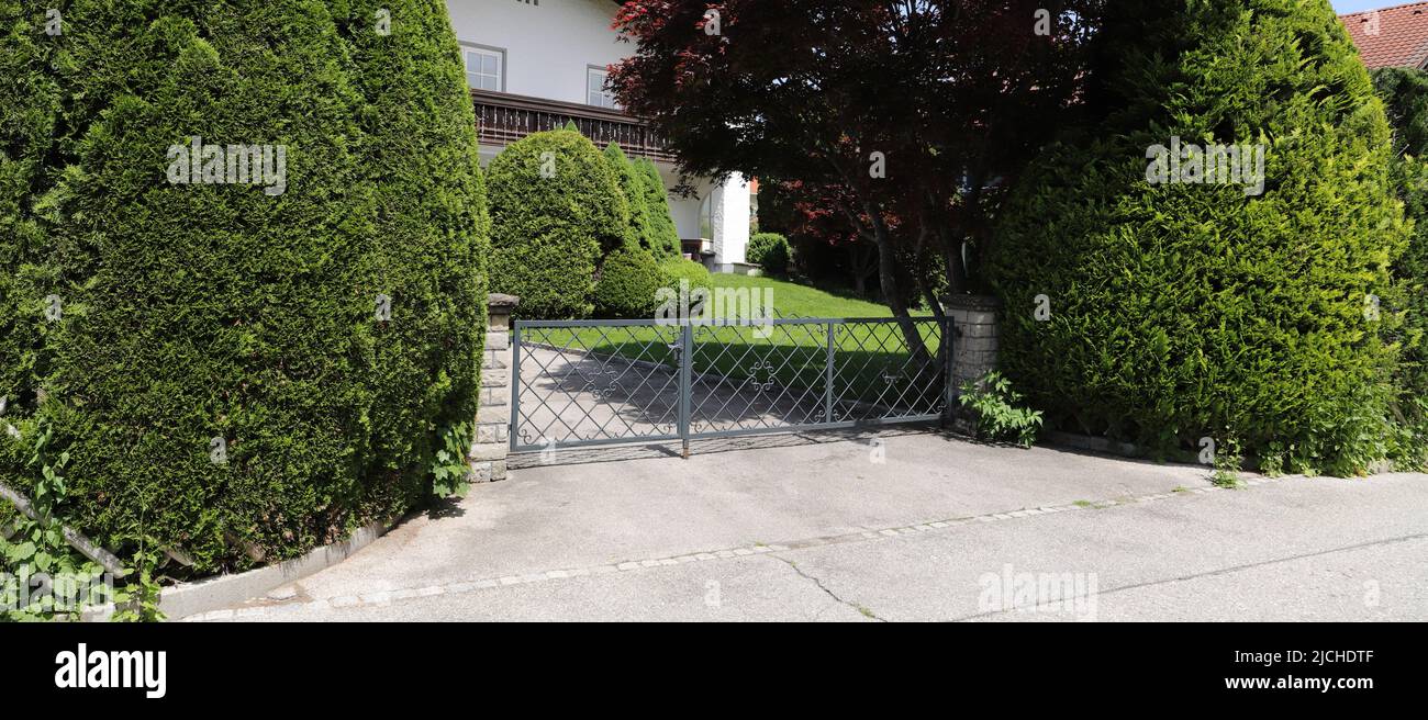 a new house with a driveway gate Stock Photo