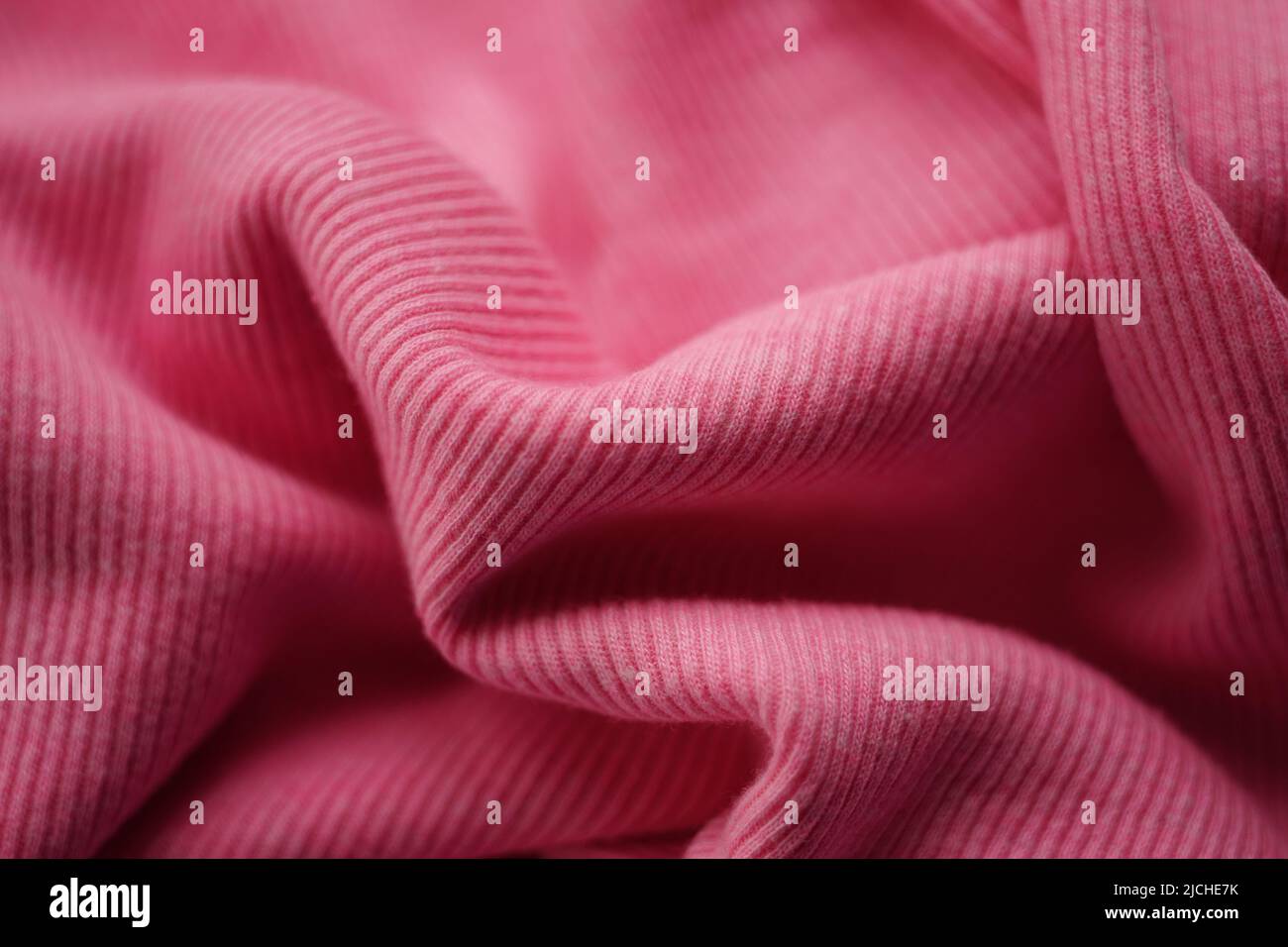 jersey pink fine ribbed pattern, soft wrinkled fabric Stock Photo - Alamy