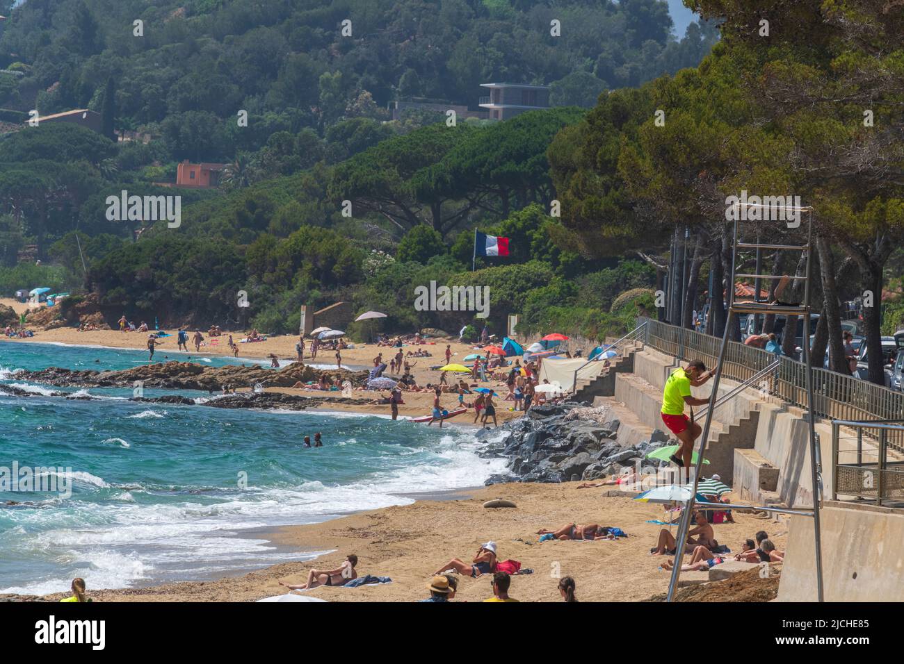 A lifeguard climbs down from a look out post on Gigaro Beach in June, Var, Provence-Alpes-Côte d'Azur, France. Stock Photo