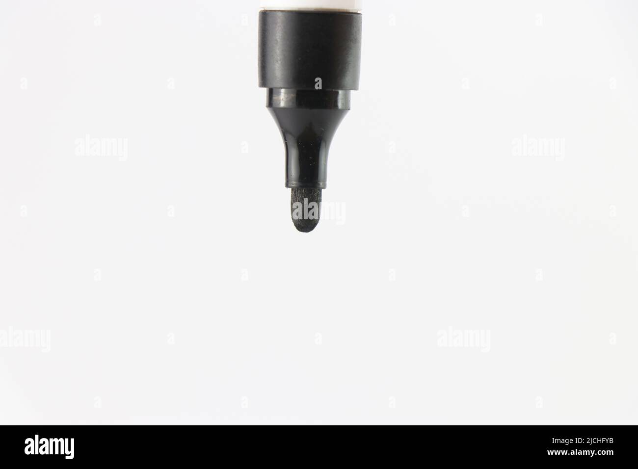 Tip of black marker pen with soft tip nib on white background Stock Photo