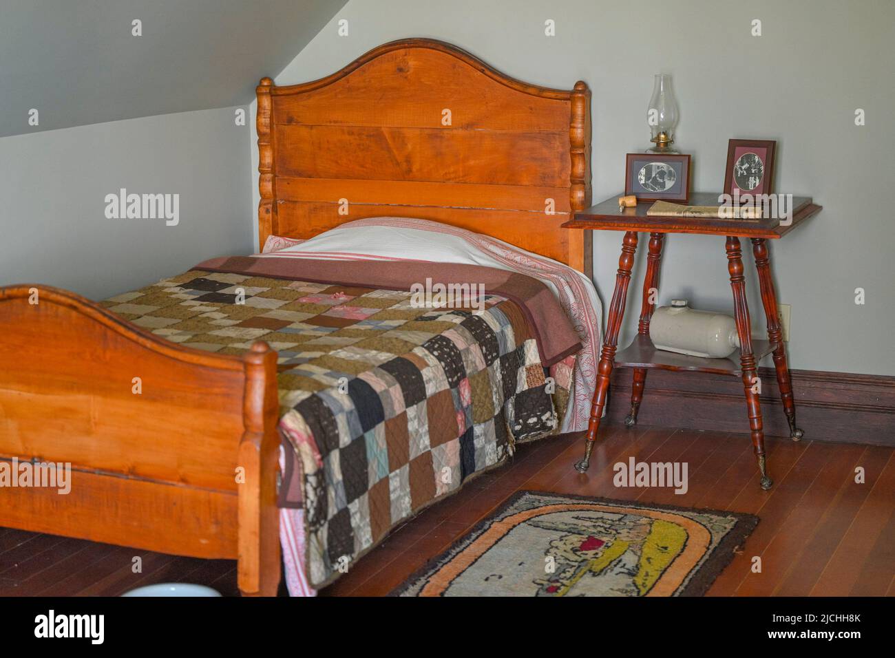 Bed, bedroom, Historic Stewart Farm, Elgin Heritage Park, Crescent Beach, Surrey, British Columbia, Canada Stock Photo