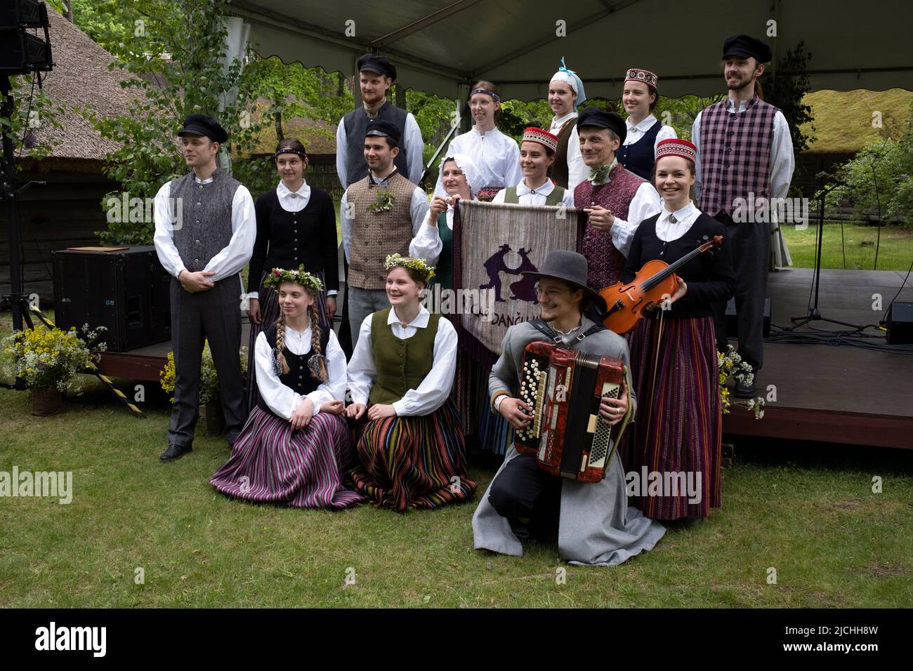 Riga Dance Club dancers in national costumes posing for photos before dance performance at The Ethnographic Open-Air Museum of Latvia, Riga, Latvia Stock Photo