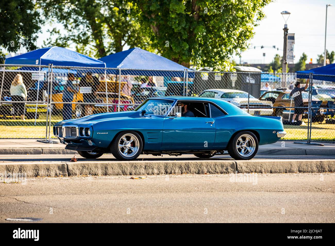 A 1969 Pontiac Firebird arrives at the American Graffiti charity Car Show at the Modesto Junior College campus June 11-12 2022 Stock Photo