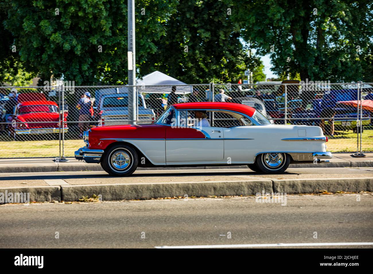 A 1956 Oldsmobile 88 coupe arrive at the American Graffiti charity Car Show at the Modesto Junior College campus June 11-12 2022 Stock Photo