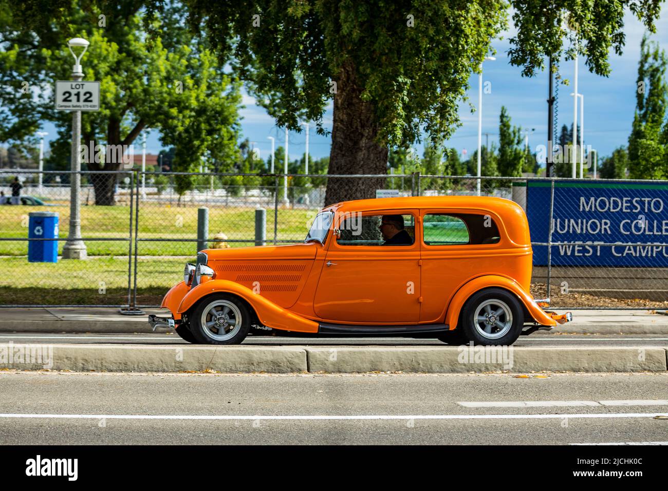 A 1934 Ford Sedan arrives at the American Graffiti charity Car Show at