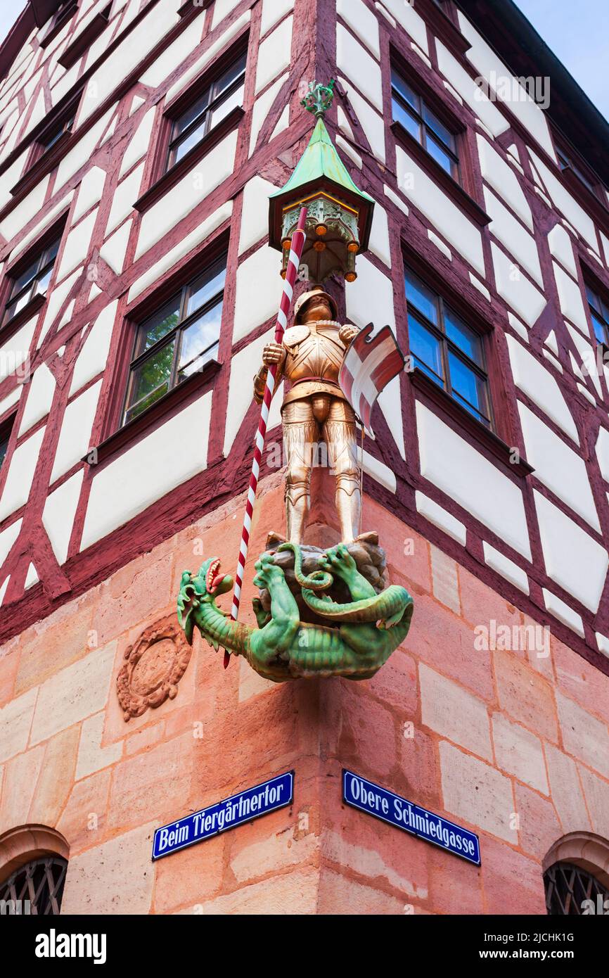 Nuremberg, Germany - July 10, 2021: Saint George slaying the dragon at the Pilatushaus or House of the Armored Man in Nuremberg old town, Bavaria stat Stock Photo