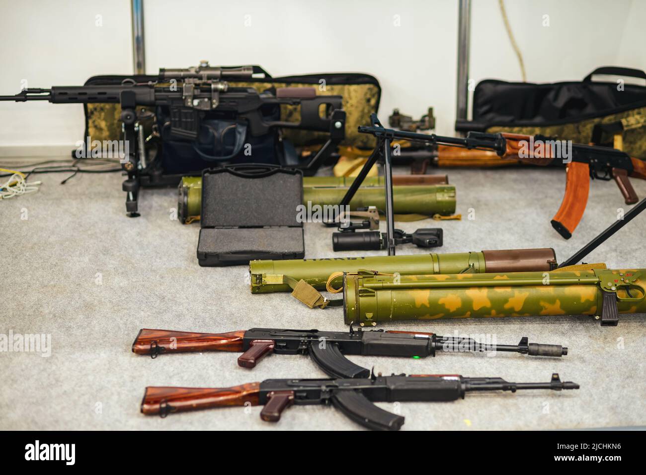 Arsenal of weapons. Anti-tank missile system, Kalashnikov assault rifles, machine guns. Stock Photo