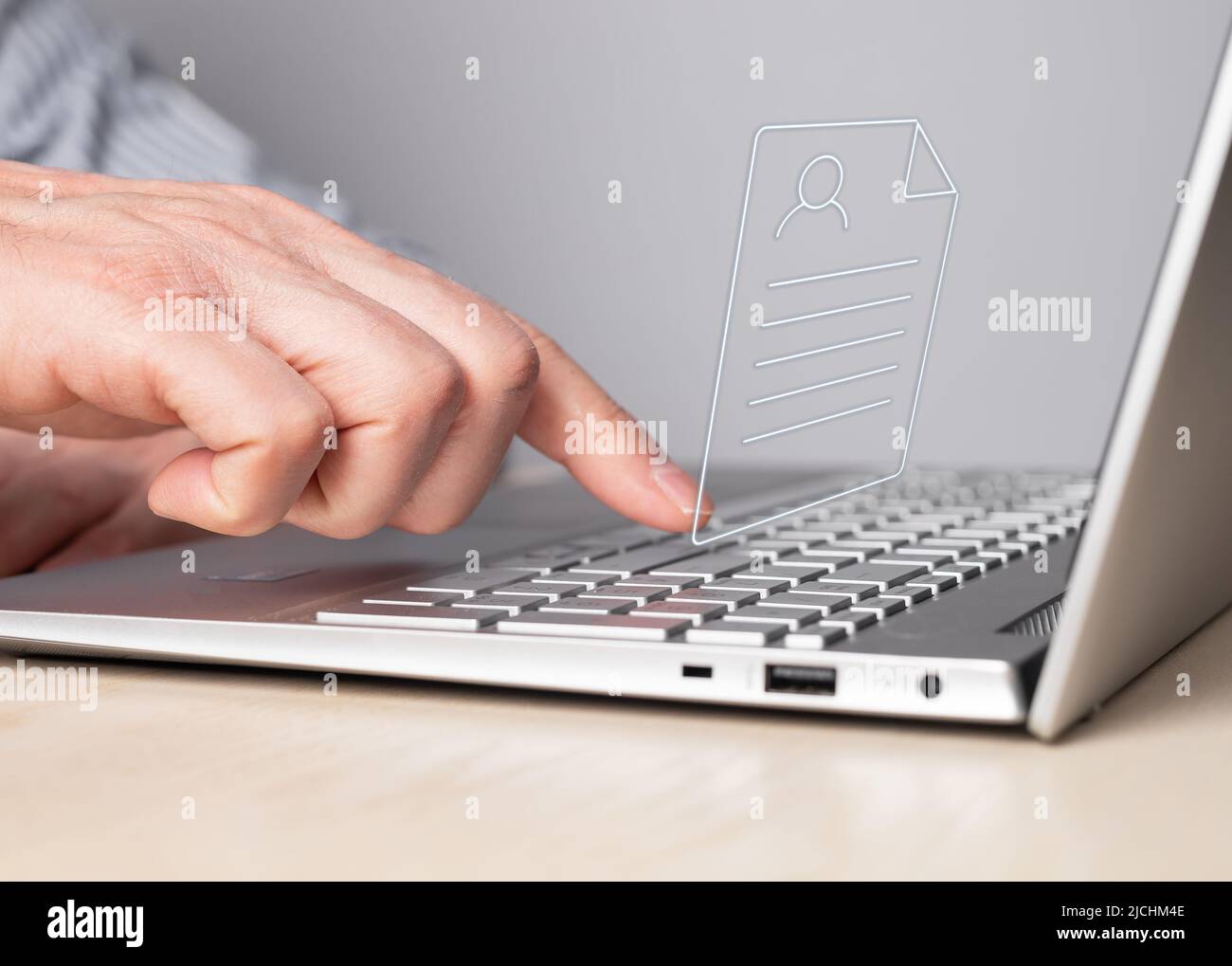CV, application submission. Man working on laptop and sending curriculum vitae. Male forefinger pressing enter button. Resume uploading concept. High quality photo Stock Photo