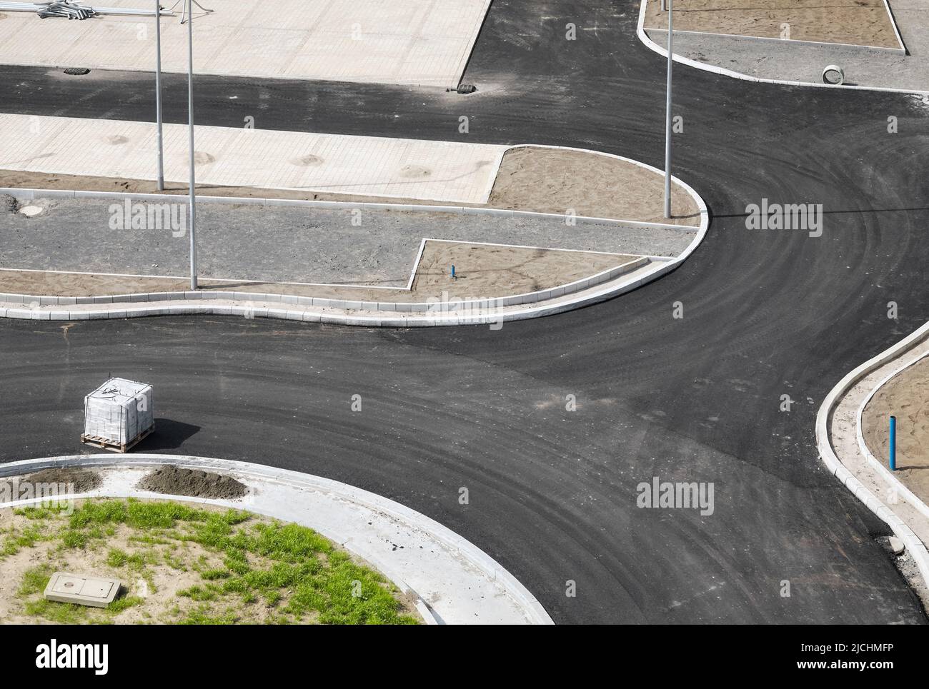Aerial view of newly built intersection and parking, construction site. Stock Photo