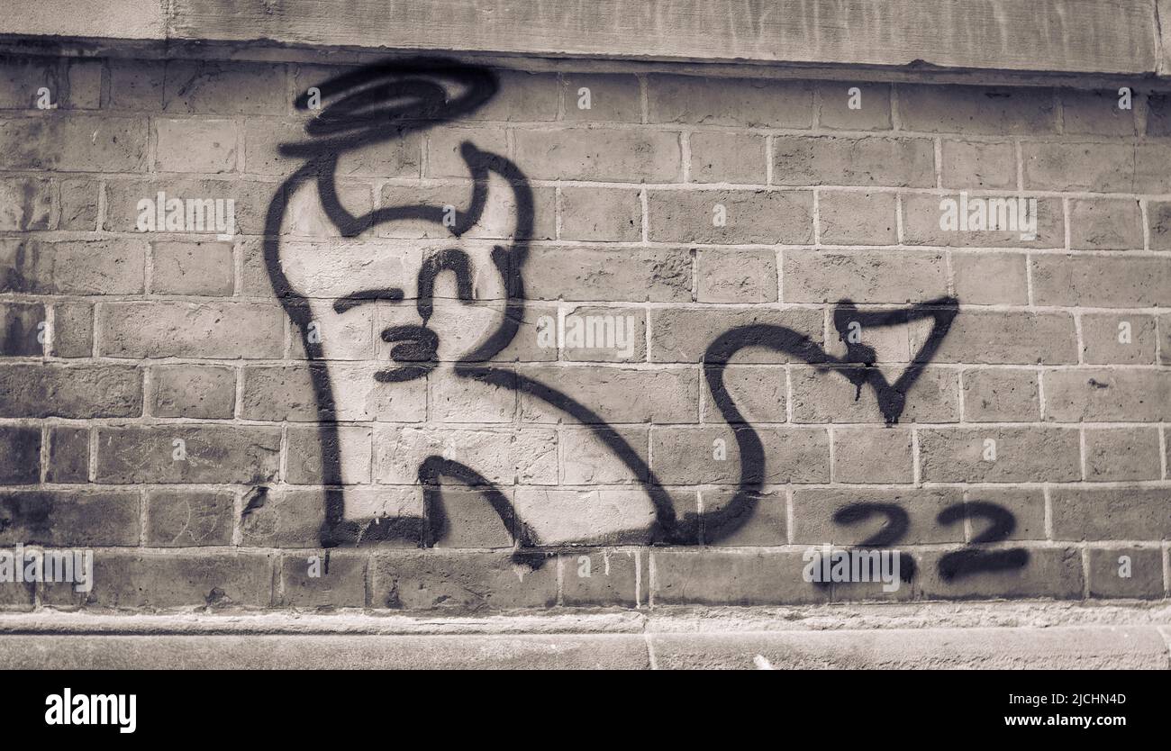 A black and white image of a graffiti devil on a UK city wall Stock Photo Alamy