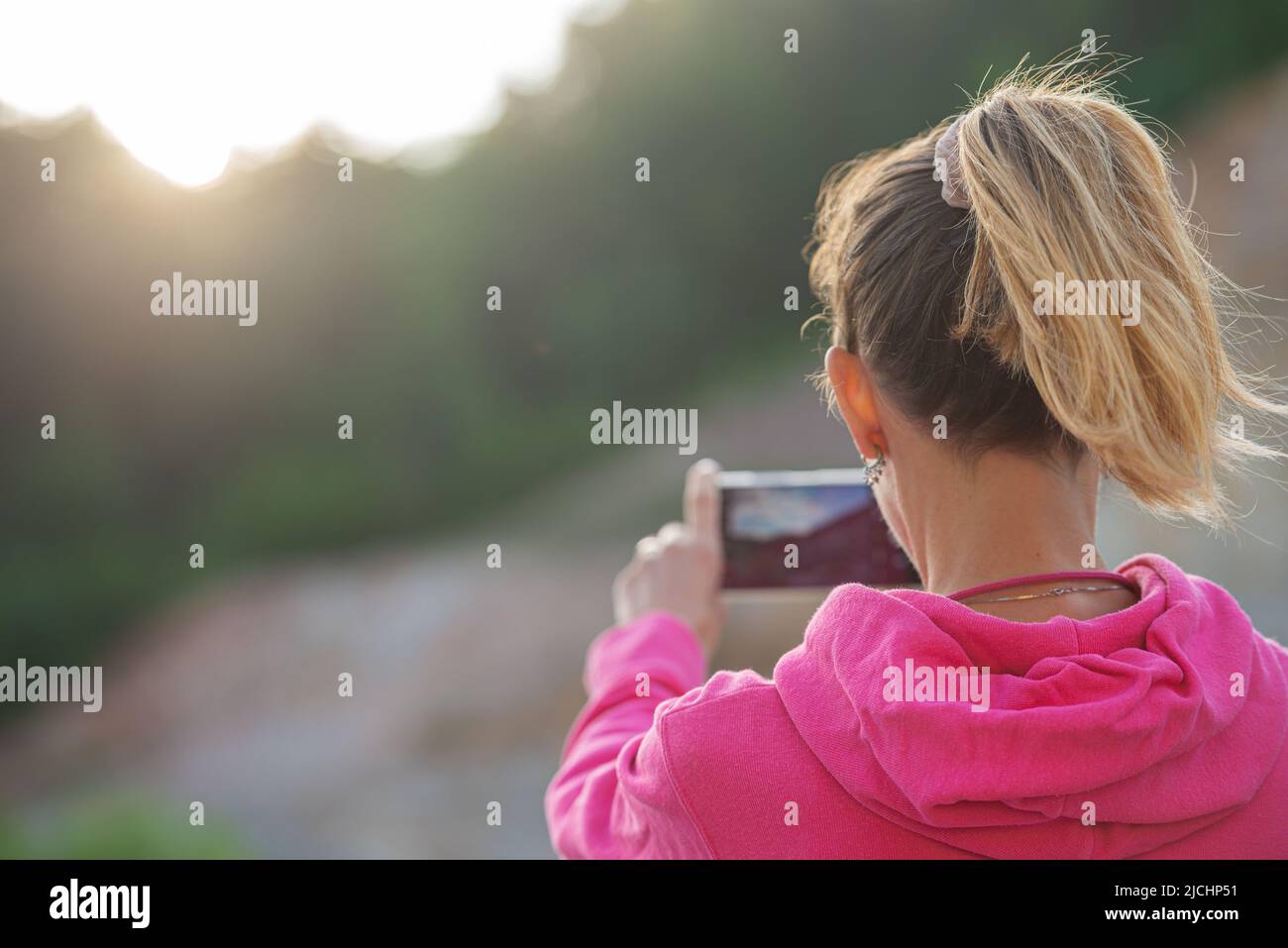 Woman mobile phone behind hi-res stock photography and images - Alamy