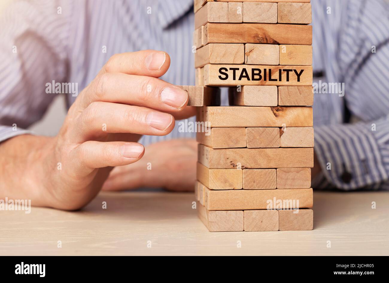 Concept of ruining balance and stability in business and economy. Unstable and instability. High quality photo Stock Photo