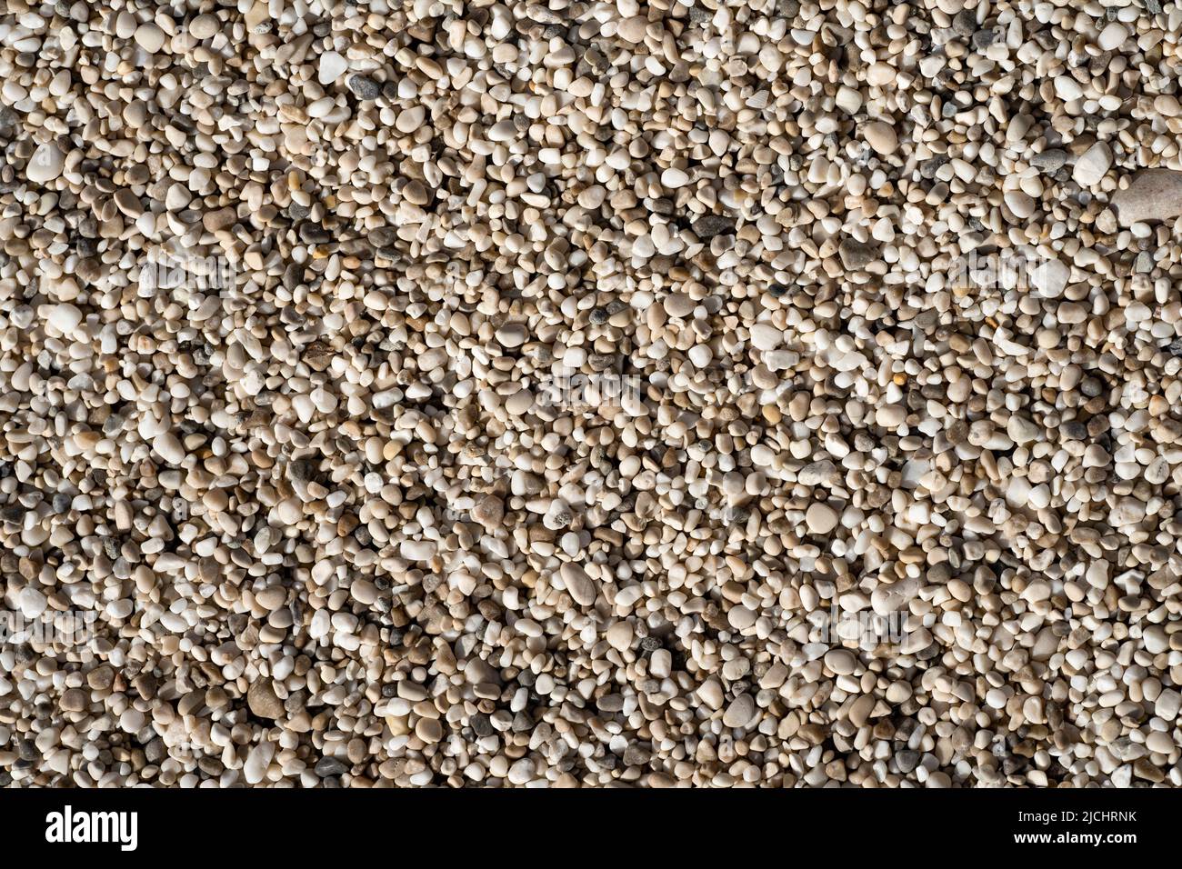 Beautiful small sea stone pebble background. Multicolored abstract beach nature pattern Stock Photo